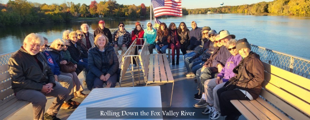 Community members on a Fox Valley river boat excursion